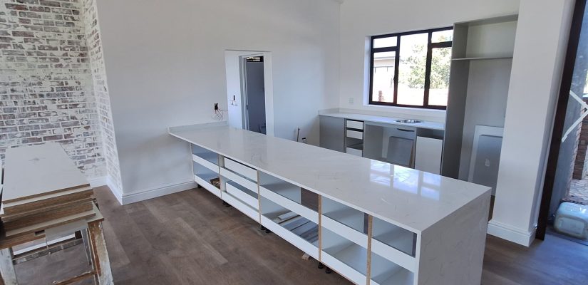 Close-up of a polished marble countertop with elegant veining, installed by Eden Marble & Granite, showcasing expert craftsmanship and luxurious design.